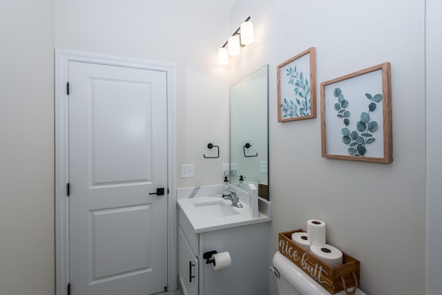 bathroom with toilet and vanity