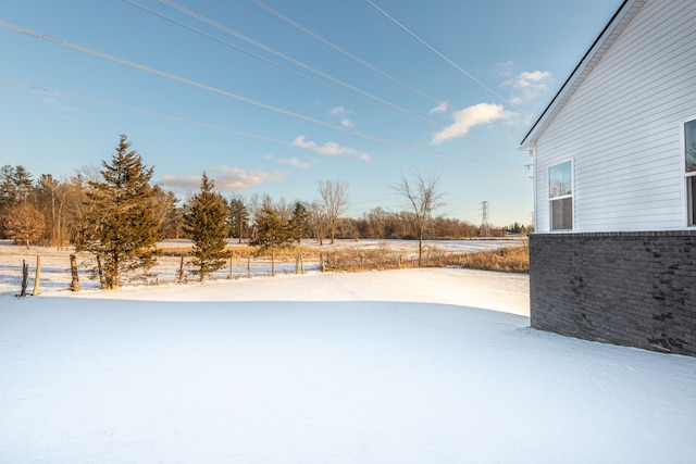 view of yard covered in snow