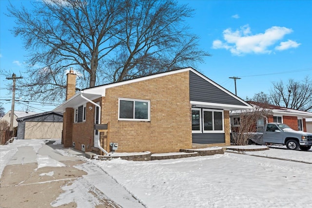 exterior space featuring a garage and an outdoor structure