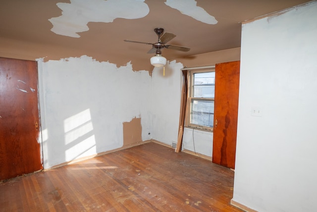 unfurnished room featuring ceiling fan and hardwood / wood-style floors