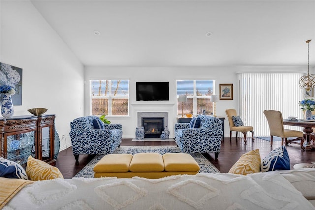 living room featuring lofted ceiling and dark hardwood / wood-style flooring