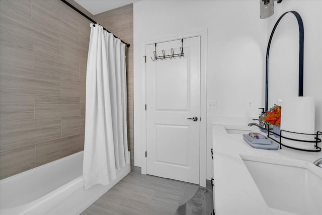 bathroom with vanity and shower / tub combo with curtain