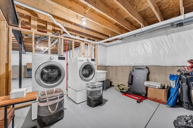 clothes washing area featuring washer and dryer