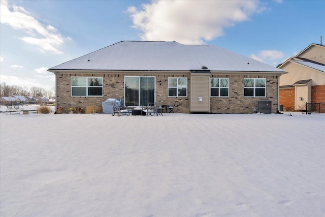 rear view of property featuring central air condition unit