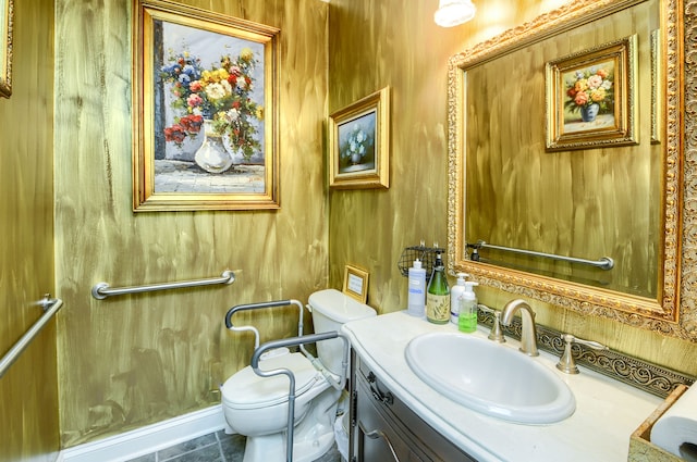 bathroom featuring tile patterned flooring, vanity, and toilet