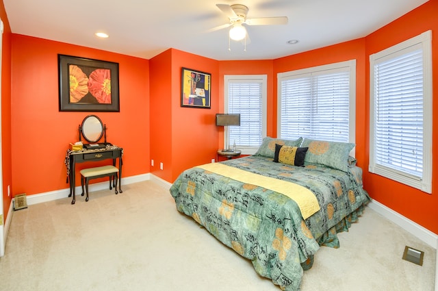 bedroom with ceiling fan and carpet