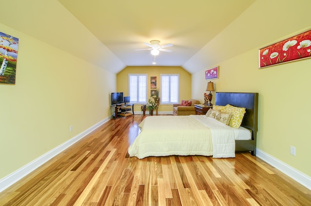 bedroom with lofted ceiling, ceiling fan, and light hardwood / wood-style floors