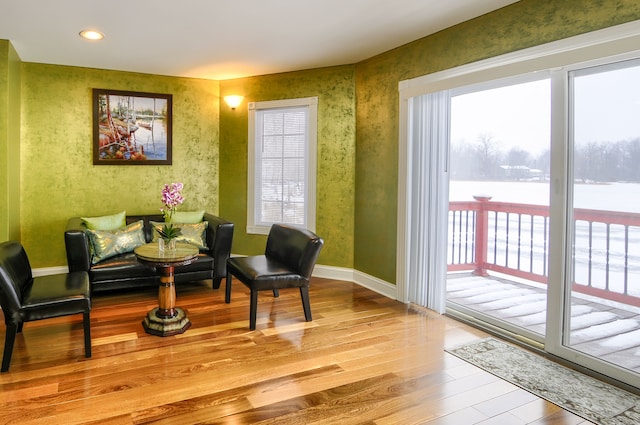 living area with light hardwood / wood-style floors