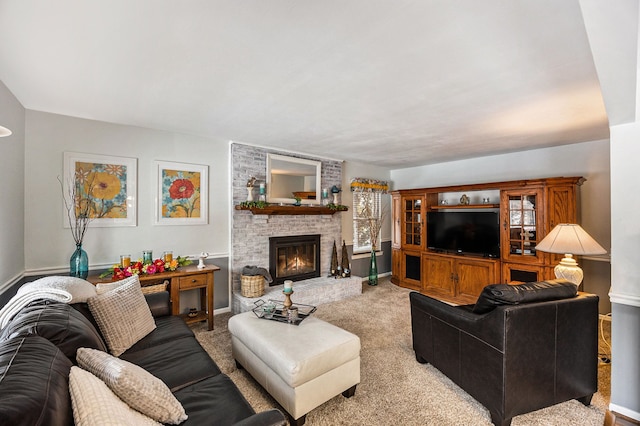 carpeted living room with a brick fireplace