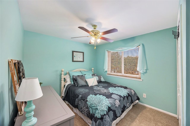 bedroom featuring light carpet and ceiling fan