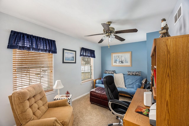 home office with ceiling fan and carpet floors