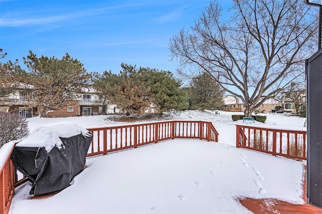 snow covered deck with grilling area