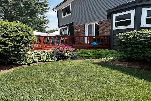 view of yard with a wooden deck