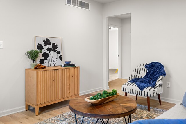 sitting room with hardwood / wood-style floors