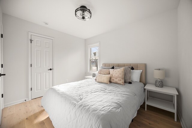 bedroom with hardwood / wood-style flooring