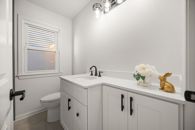 bathroom featuring toilet, vanity, and tile patterned floors