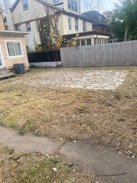 view of yard featuring central AC and a patio area