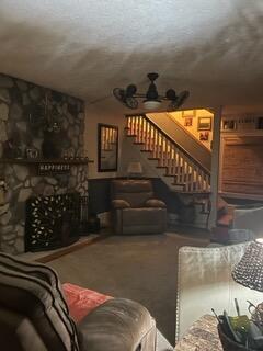 interior space with ceiling fan and a fireplace