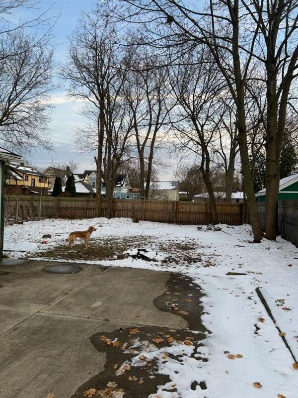 view of yard layered in snow