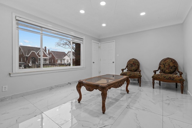 sitting room featuring ornamental molding