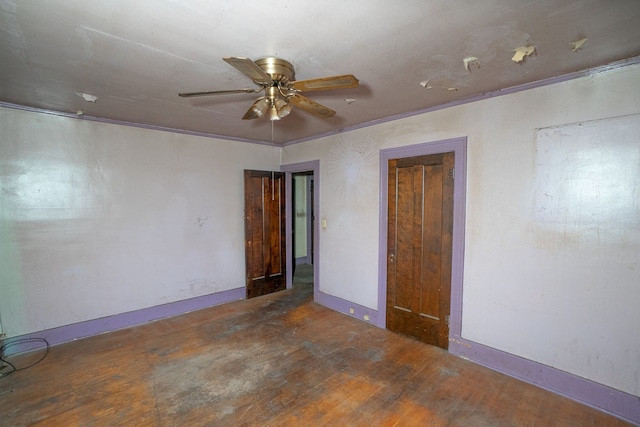 spare room with ornamental molding, ceiling fan, and dark hardwood / wood-style floors