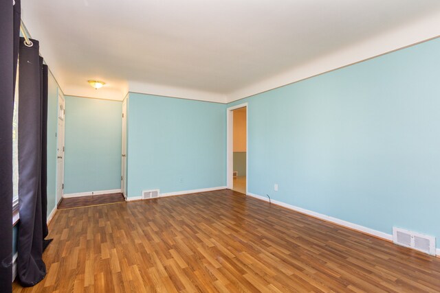 empty room featuring hardwood / wood-style floors