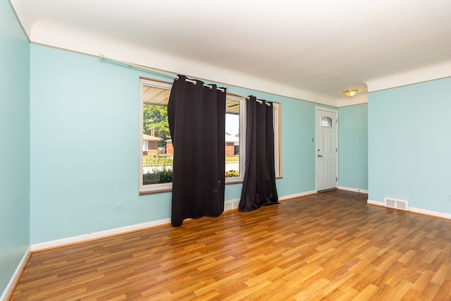 empty room featuring hardwood / wood-style floors