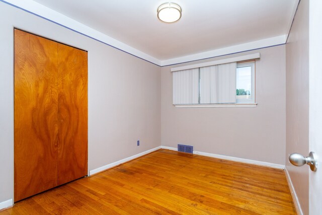 empty room featuring hardwood / wood-style flooring