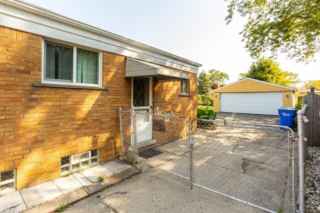 exterior space with a garage and an outdoor structure