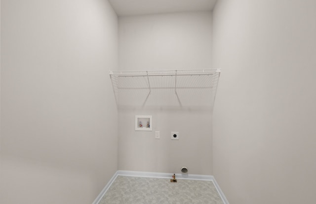 washroom with washer hookup, hookup for an electric dryer, gas dryer hookup, laundry area, and baseboards