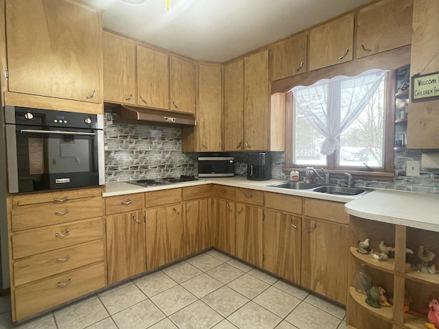 kitchen with light tile patterned floors, wall oven, decorative backsplash, cooktop, and sink