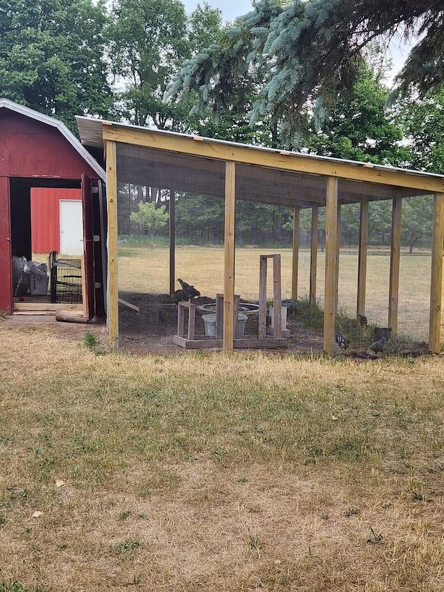 exterior space with an outbuilding and a yard