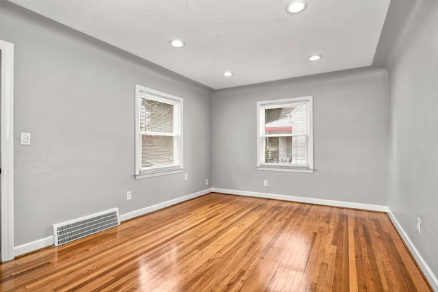 spare room with light hardwood / wood-style flooring