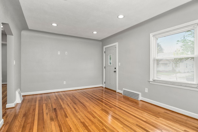 spare room featuring light hardwood / wood-style floors