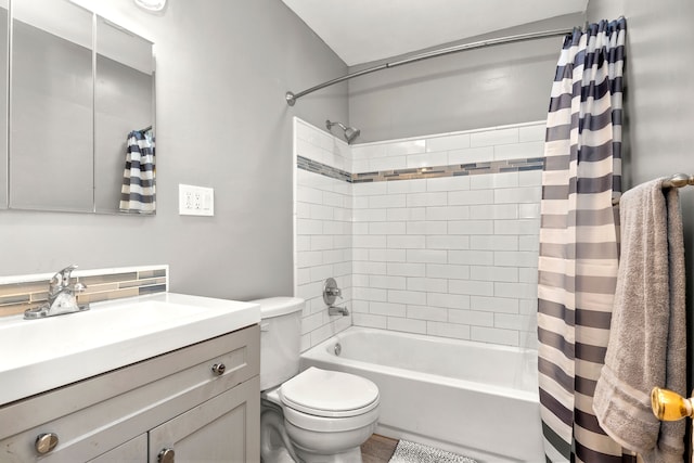 full bathroom featuring toilet, vanity, and shower / bath combo