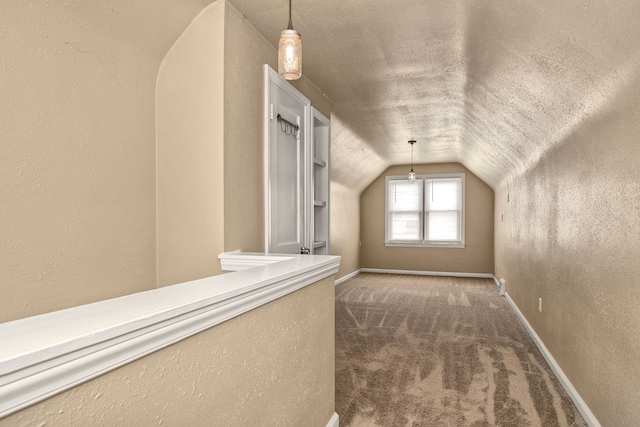 additional living space featuring lofted ceiling and carpet