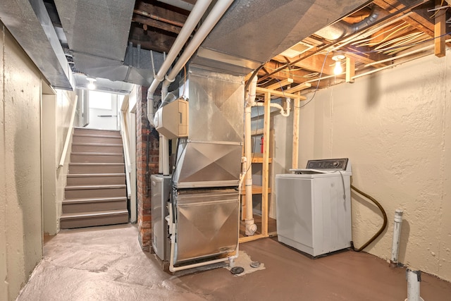 basement with washer / dryer and heating unit