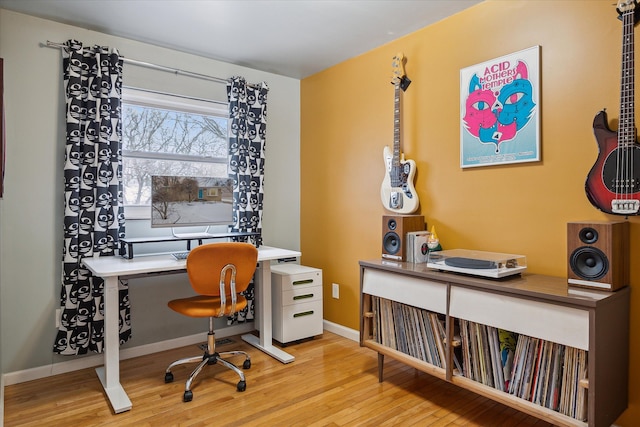 office with light wood-type flooring