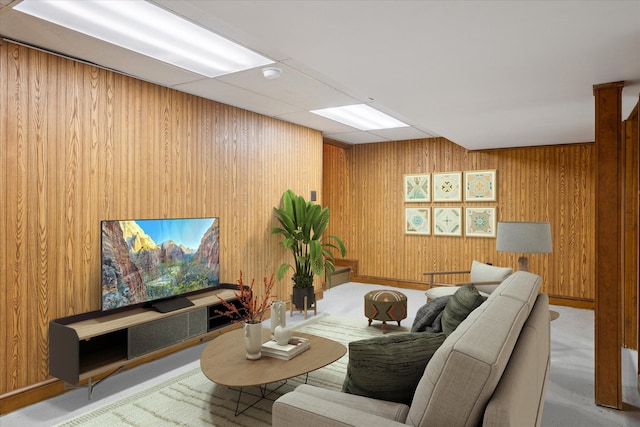 living room with wood walls and carpet flooring