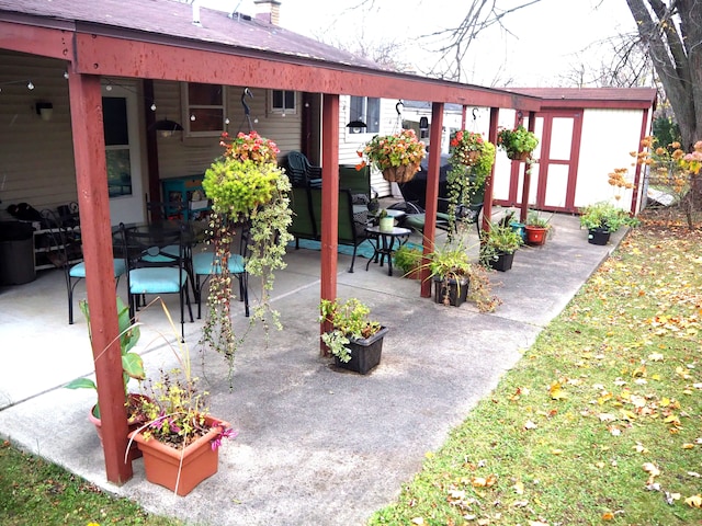 view of patio / terrace with a storage unit