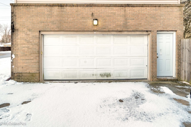 view of snow covered garage