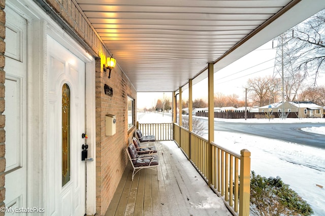 view of snow covered deck