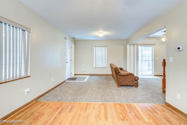 unfurnished room with hardwood / wood-style flooring and ceiling fan