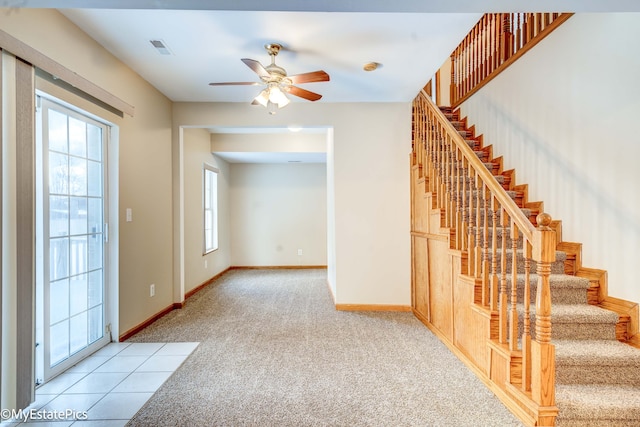 interior space featuring ceiling fan