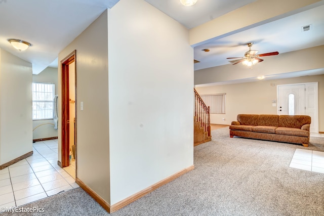 living room with ceiling fan and light colored carpet