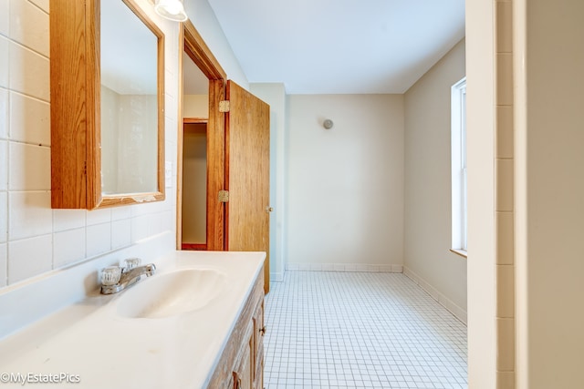 bathroom with vanity and tile patterned flooring