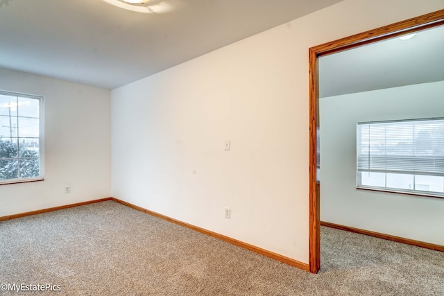 unfurnished room featuring carpet floors