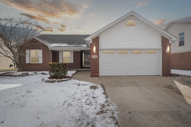 ranch-style home featuring a garage