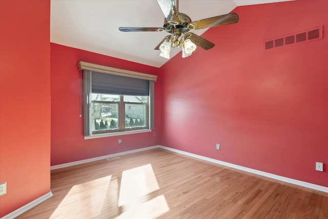 unfurnished room featuring light wood-type flooring, vaulted ceiling, and ceiling fan