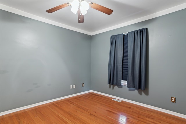 unfurnished room with crown molding, hardwood / wood-style flooring, and ceiling fan